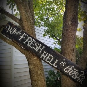 handpainted sign on reclaimed wood